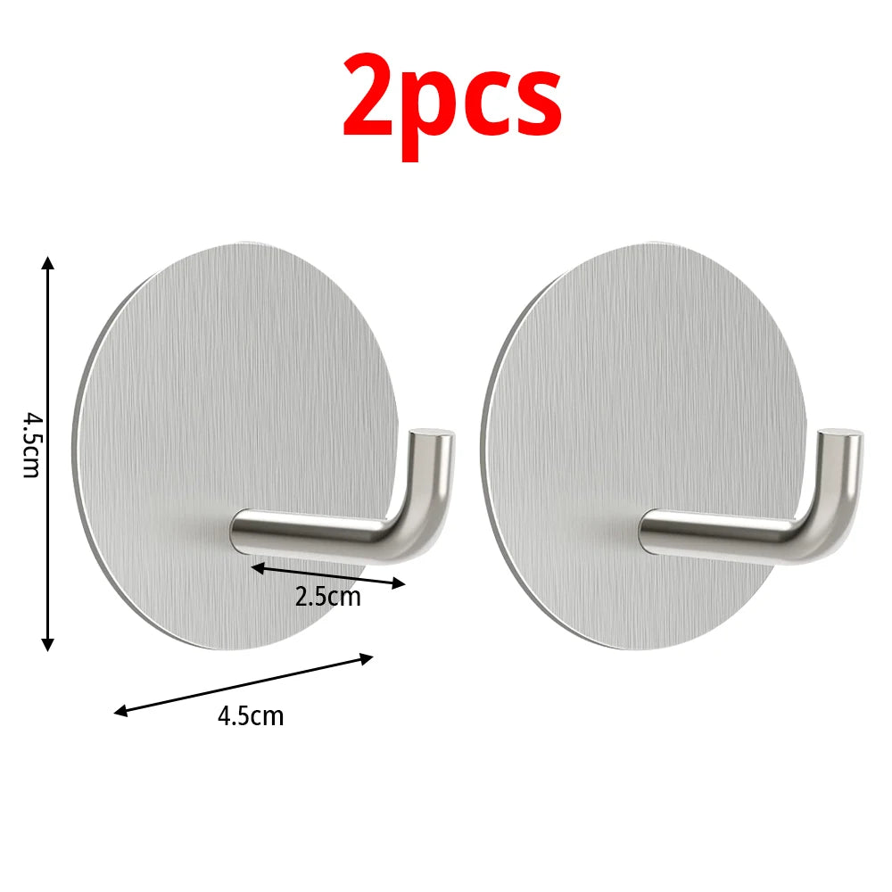 Two round stainless steel self-adhesive wall hooks with a silver finish and a curved mounting arm.