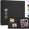 A black spiral-bound notebook with a heart design and the text 40 pages 20 sheets.