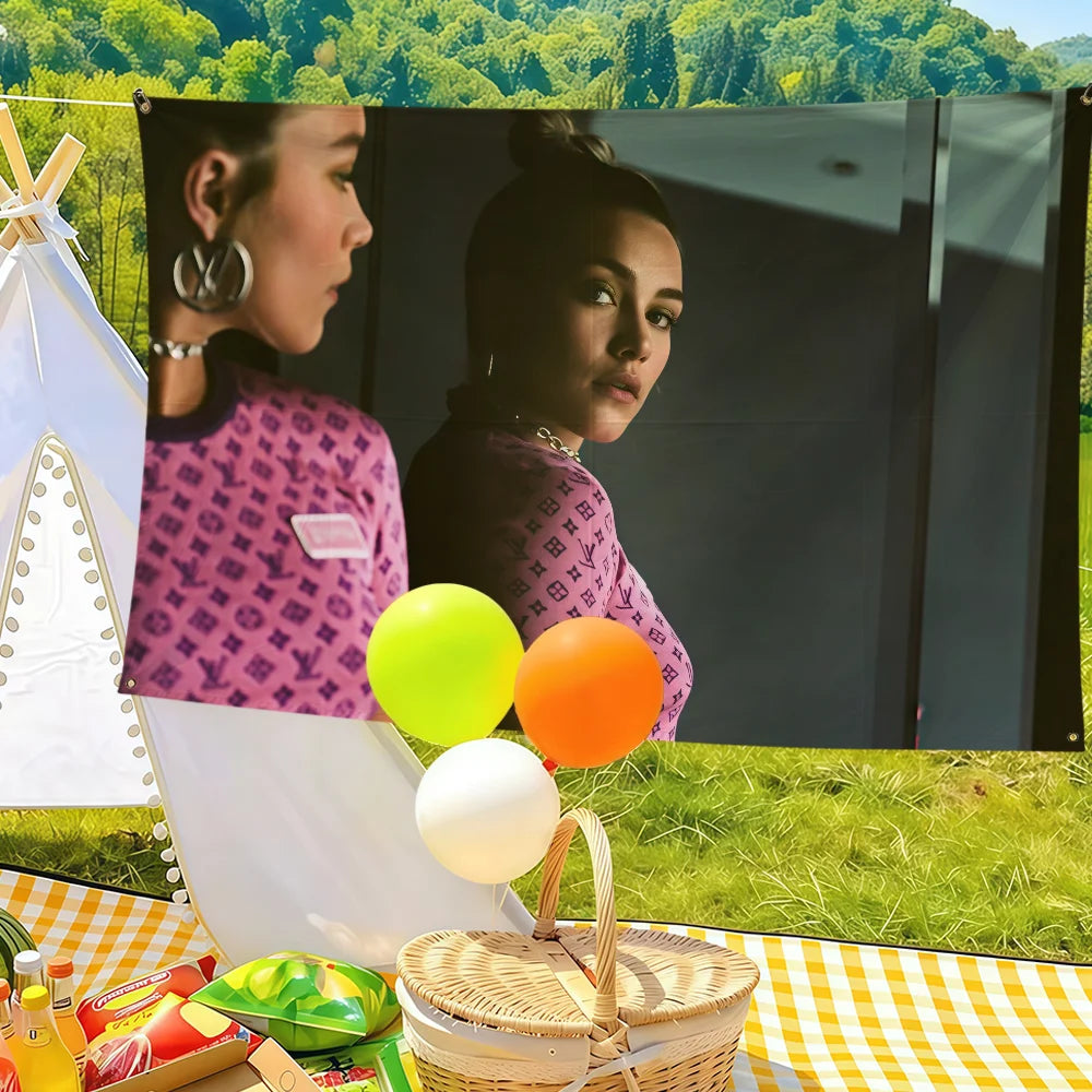 A decorative flag banner featuring Florence Pugh imagery and round yellow, orange, and white balloons.
