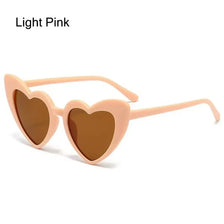 Light pink heart-shaped sunglasses with brown lenses and thin arms