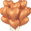 A cluster of shiny copper heart-shaped foil balloons tied together with thin gold strings.