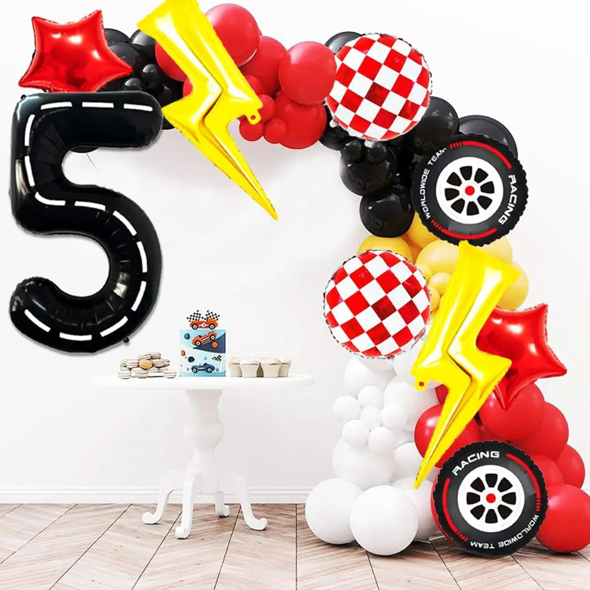 A large black foil balloon arch shaped like the number 5 decorated with red and yellow balloons and a yellow lightning bolt.