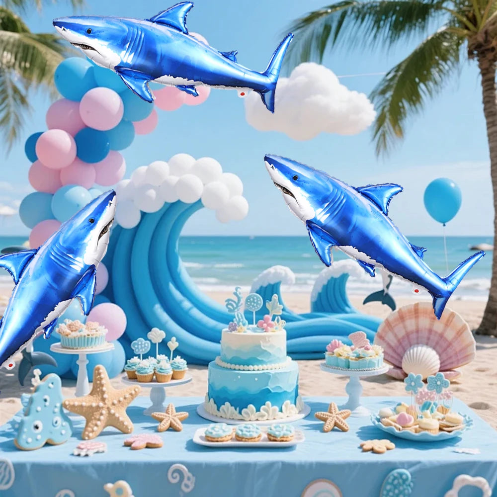 Blue shark foil balloons and decorations for an ocean-themed party display