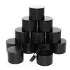 A stack of black metal candle tins with lids.
