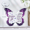 A purple and silver acrylic butterfly keepsake with a message inside, featuring the text Grandma I love you.