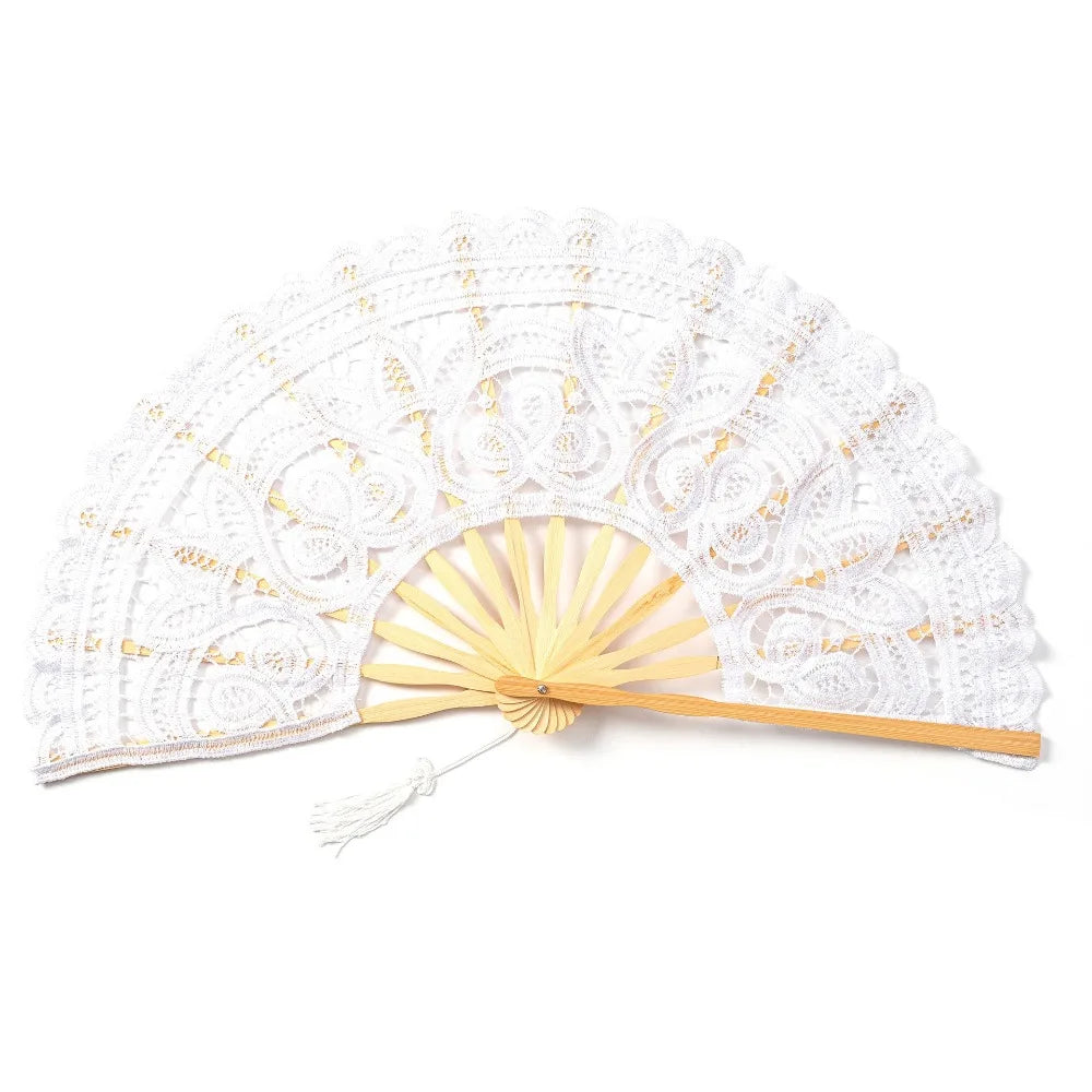 White vintage lace hand fan with a wooden handle and tassel