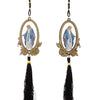 Wooden pendant ornament featuring a depiction of Our Lady of Grace with a gold frame and black tassel.