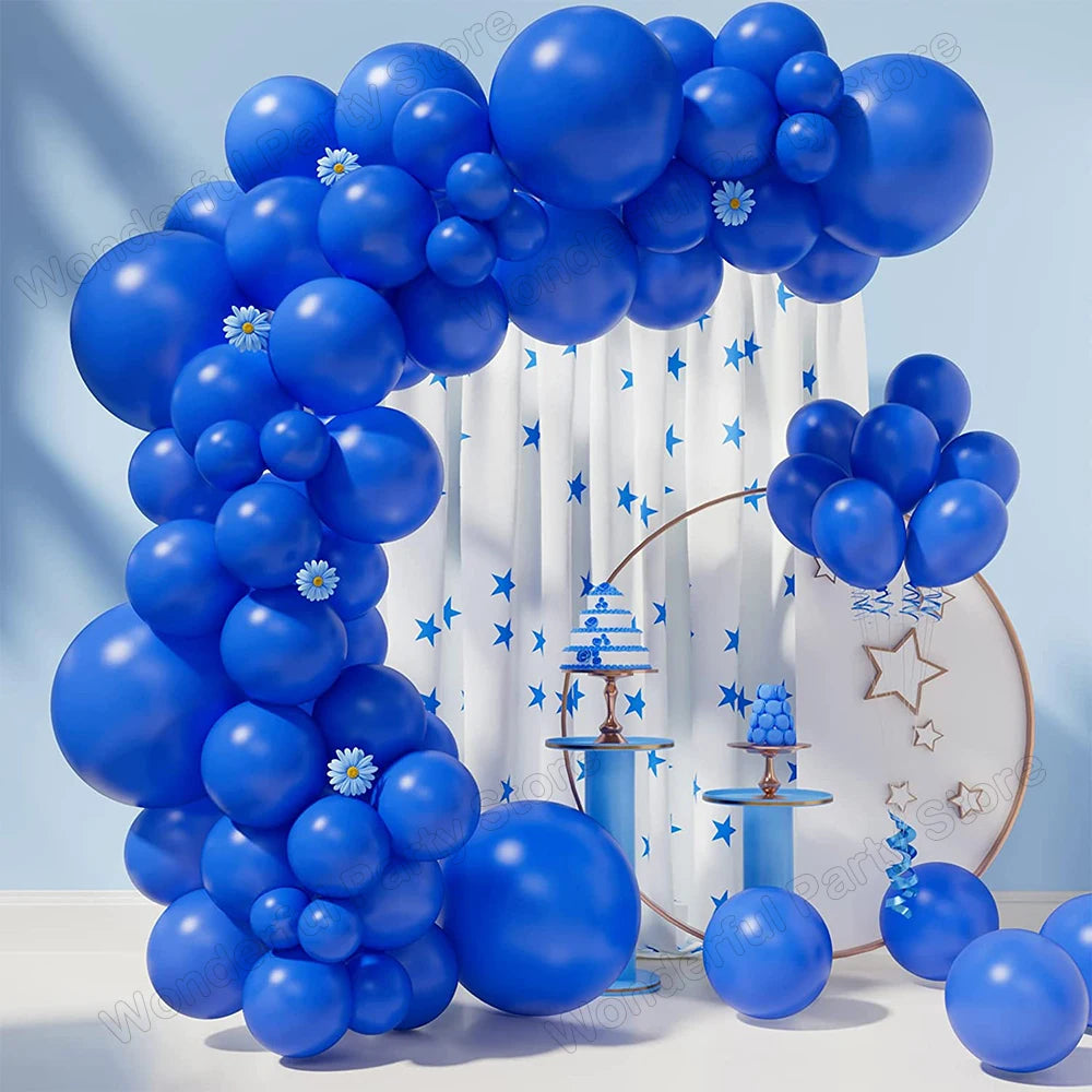 A large blue balloon garland arch decorated with white stripes and blue stars, suitable for parties.