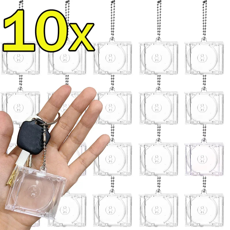 Ten mini transparent CD keychains hanging from a chain, shown next to a hand.