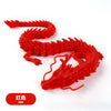 A bright red 3D printed resin figurine of a conjoined dragon with detailed scales.