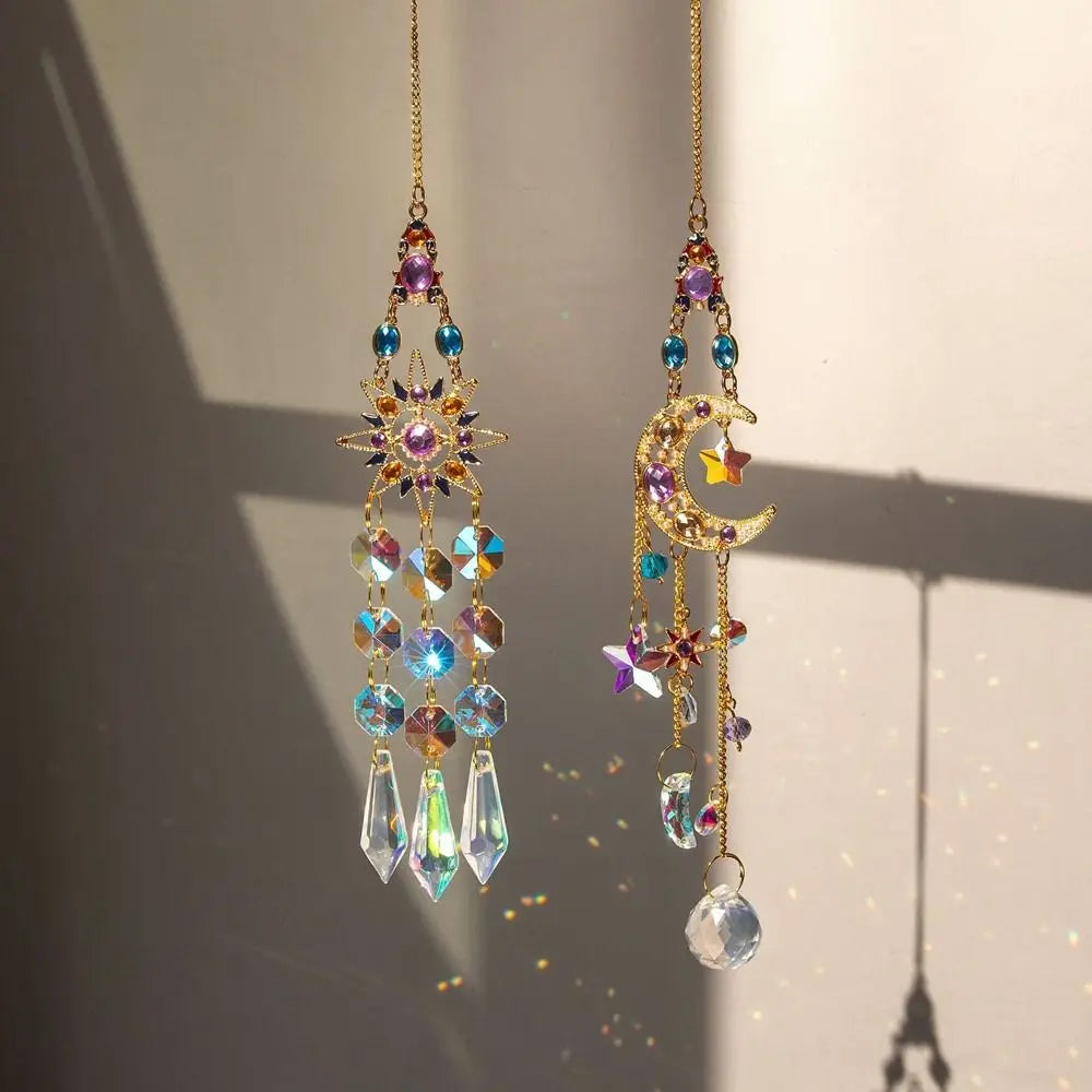 A pair of hanging crystal suncatcher wind chimes featuring colorful gemstone beads and dangling crystals.
