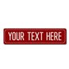 A rectangular red metal street sign with the text YOUR TEXT HERE.