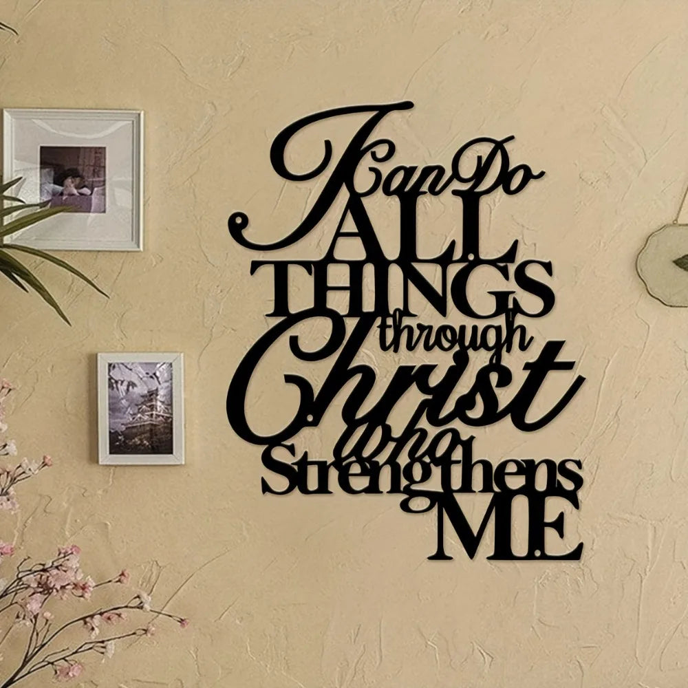 Black script wall art featuring the verse 'Can Do All Things Through Christ Who Strengthens Me' on a beige textured wall.