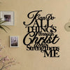 Black script wall art featuring the verse 'Can Do All Things Through Christ Who Strengthens Me' on a beige textured wall.