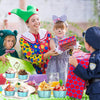 A smiling woman and two children are gathered around colorful reusable aluminum foil dessert ramekins.