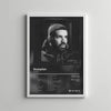 A black and white portrait of Drake on an album cover displayed as wall art.
