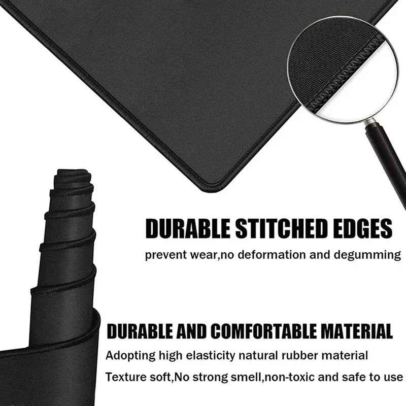 Black non-slip gaming mouse pad with durable stitched edges and comfortable natural rubber material