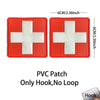 Red PVC patch with a white cross design featuring a hook for medical or tactical use