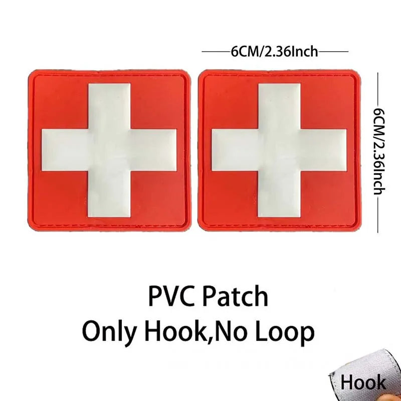 Red PVC patch with a white cross design featuring a hook for medical or tactical use