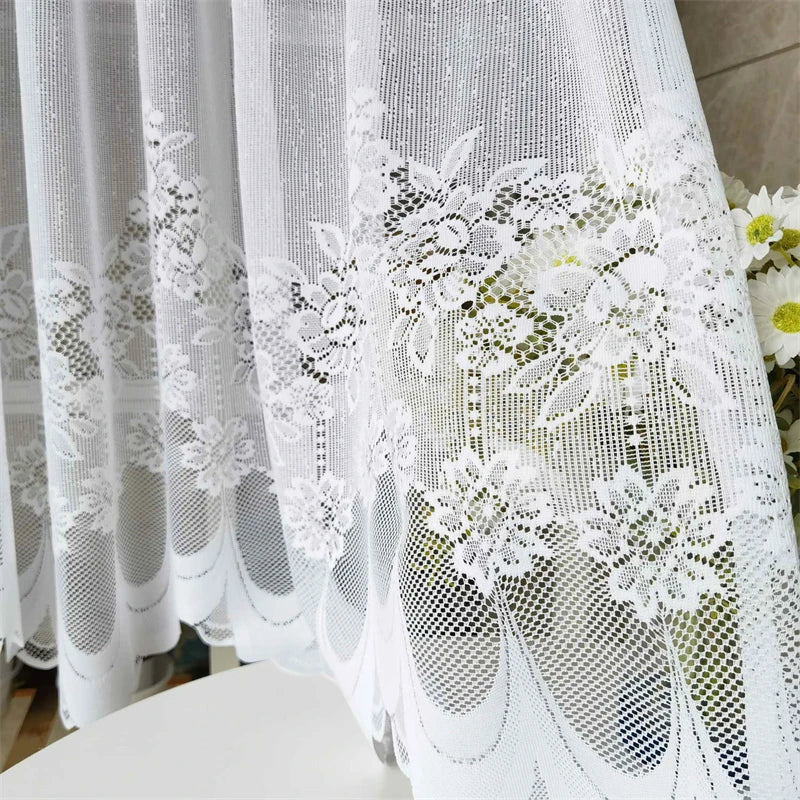 White lace mesh sheer curtain featuring floral embroidery and a rod pocket.