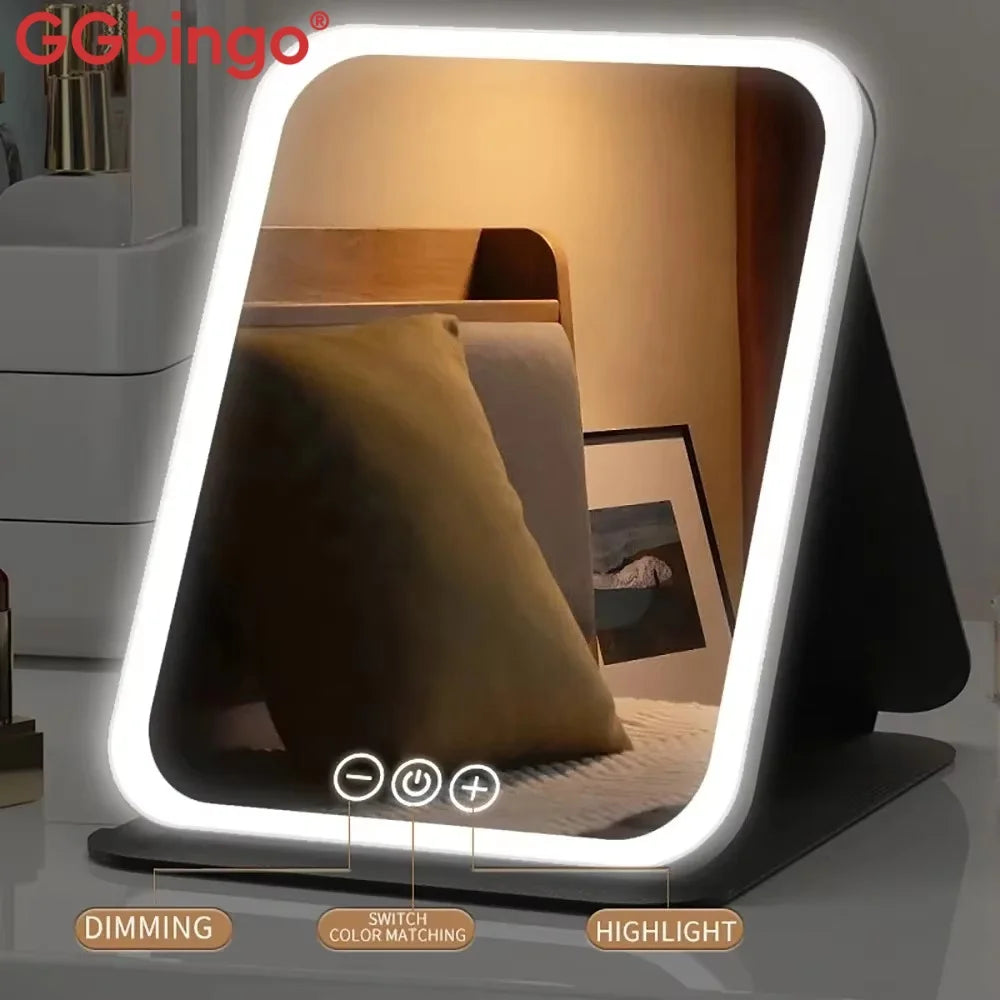 A modern vanity mirror with a glowing white frame and adjustable LED lights is shown on a dark surface.