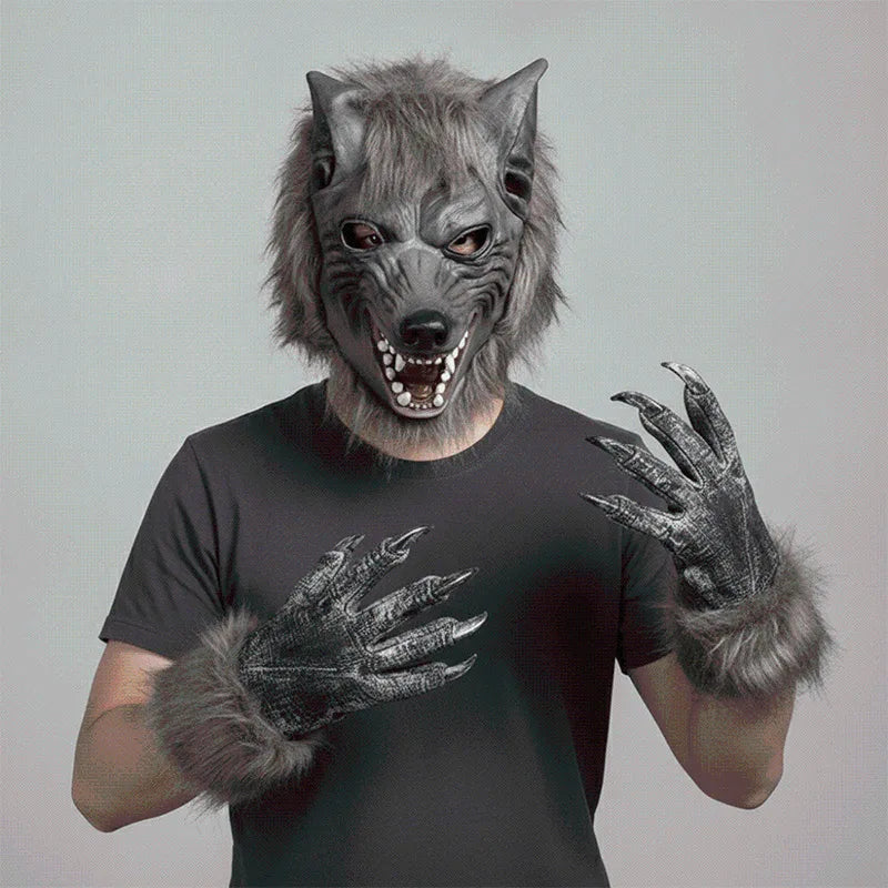 A person wearing a realistic werewolf full head mask with furry hands and teeth against a gray background.