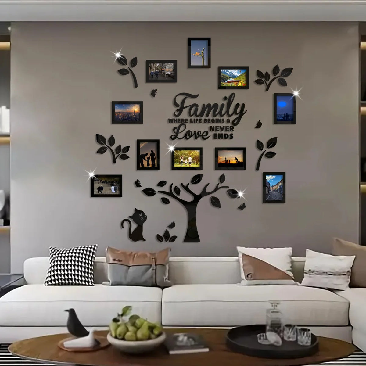 A modern living room wall decorated with a family tree collage of framed photos and leaves.