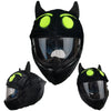 A black plush helmet cover with bright neon green accents, shown in multiple views.