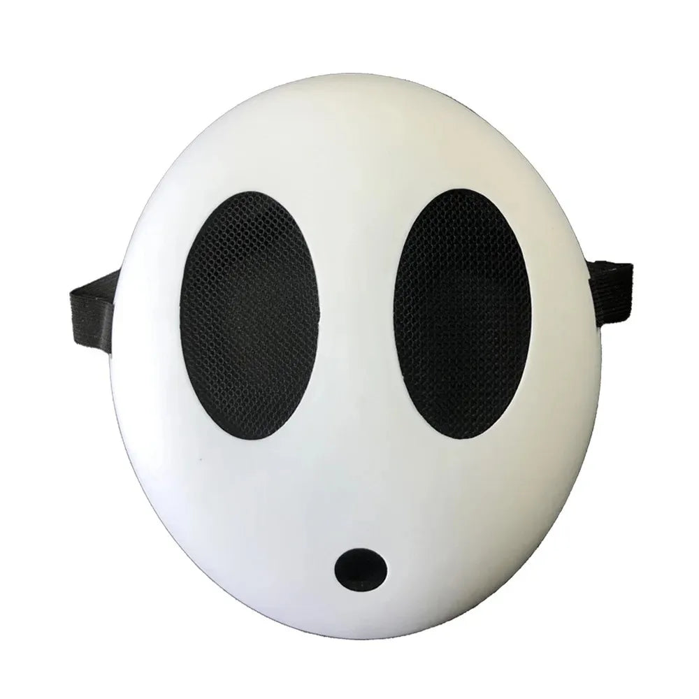 A white, round mask resembling a face with large black eye holes and a small black nose, used for cosplay or parties.