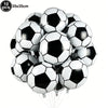 A bundle of ten black and white soccer ball balloons used for party decorations.