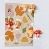 A set of nine cute decorative mushroom fridge magnets featuring various colors and shapes on a light background.