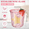 A clear pink disposable plastic wine glass filled with ice and garnished with a strawberry.