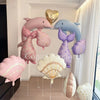 A set of pink and blue foil balloons featuring a dolphin, seashell, and mermaid tail decorations.