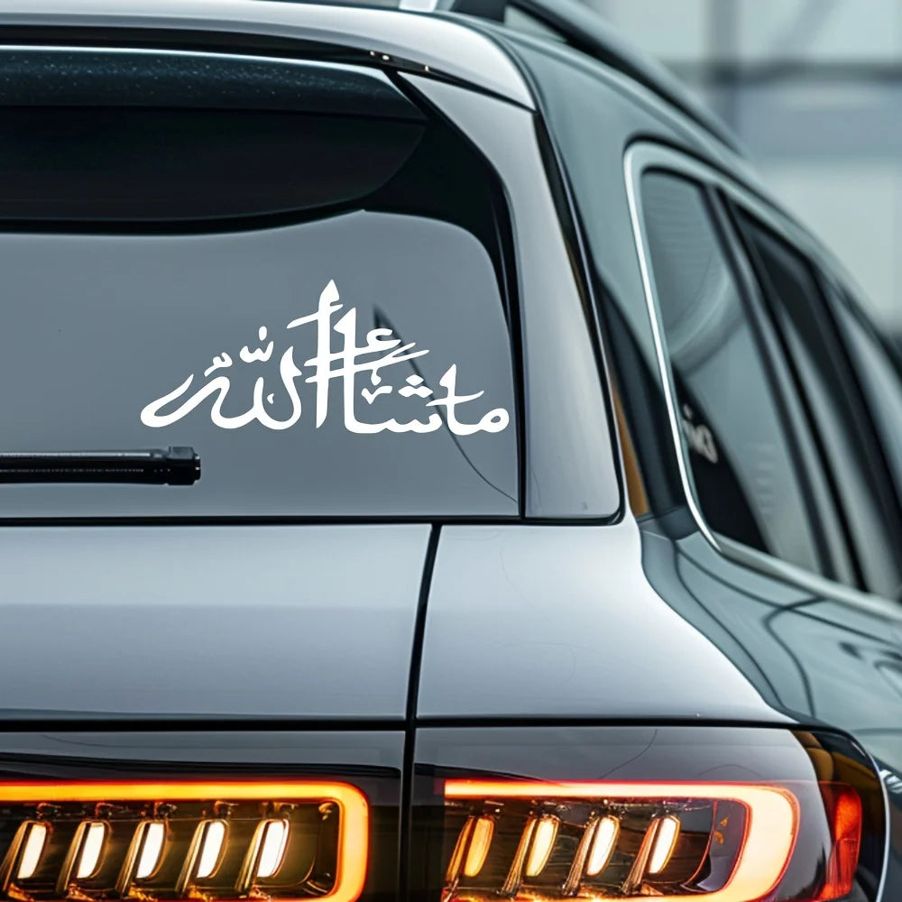 Close-up of a dark car with white Islamic calligraphy vinyl decal on the window and headlight.