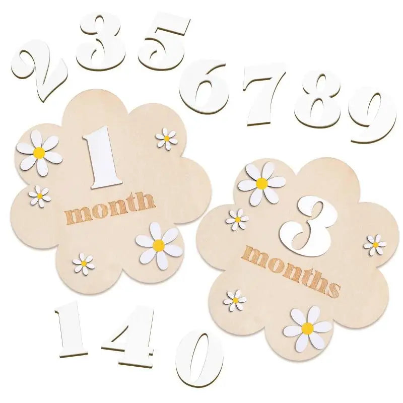 A set of wooden monthly milestone cards showing numbers 1 through 9 and the word months on cloud shapes.