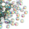 A collection of round flatback resin rhinestones in various iridescent colors and shades scattered on a white background.
