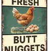 Vintage metal sign with text reading FARM FRESH and BUTT NUGGETS featuring a brown chicken.