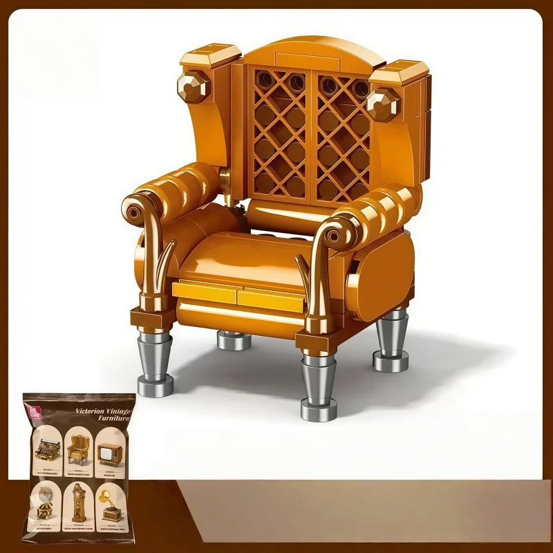 A detailed miniature vintage armchair model in orange-yellow wood with brass accents.