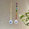 A pair of crystal prism suncatchers featuring strings of colorful beads and faceted crystal pendants.