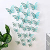 A set of 3D hollow butterfly wall decals in various shades of blue and green on a white background.