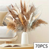 Dried flower bouquet featuring feathery pampas grass in shades of brown, beige, and white