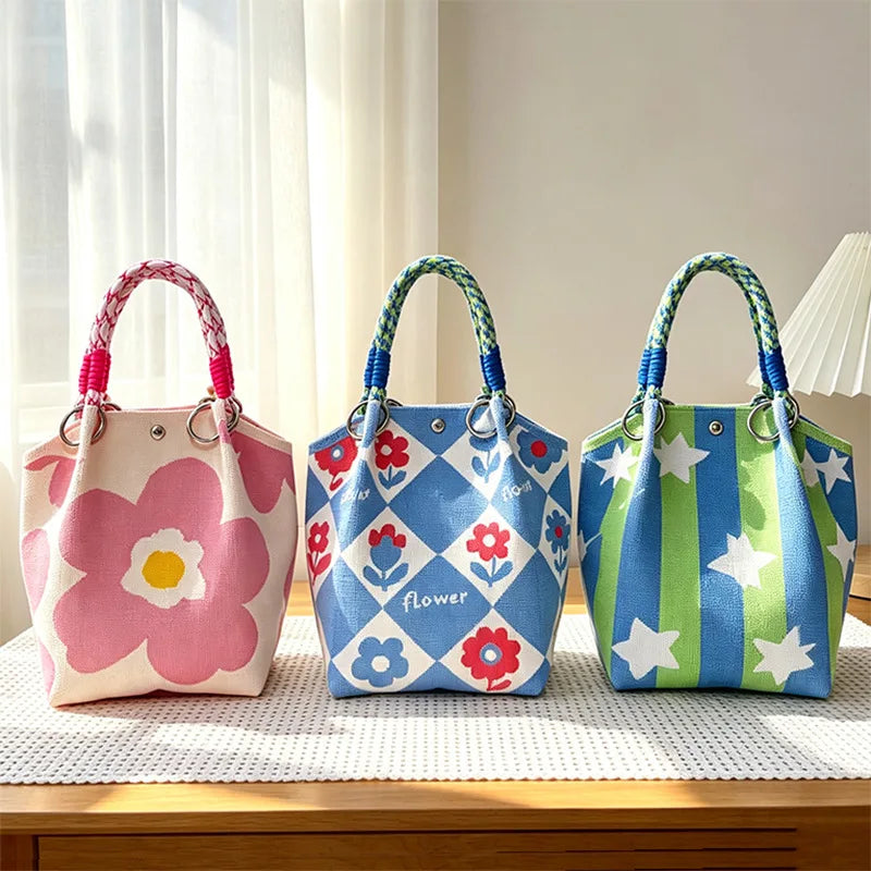 Three colorful jacquard knitted shoulder bags featuring floral patterns and geometric designs.