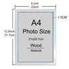 A rectangular wooden photo frame with a silver border and an A4 size, measuring 21x29.7cm.