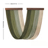Boho macrame wall tapestry featuring vertical strands in shades of olive green and beige.