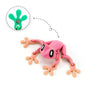 Pink articulated frog magnet with green details, showing its movable limbs.