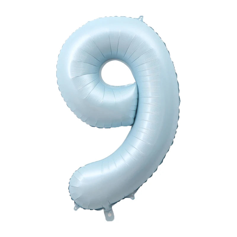 Light blue foil number balloon shaped like the number 9