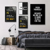 A gallery wall featuring three black and white motivational quotes about self-belief and pushing yourself on a gray wall.