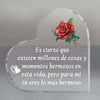 A clear glass heart-shaped keepsake with a red rose design and a loving message engraved on it.