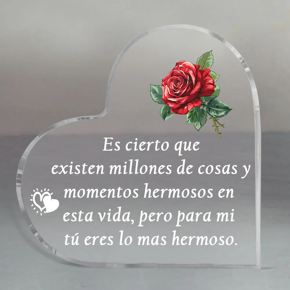 A clear glass heart-shaped keepsake with a red rose design and a loving message engraved on it.
