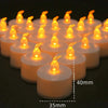 A row of glowing orange LED tea light candles in white holders, shown from above.